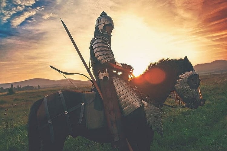 knight on a horse at sunset